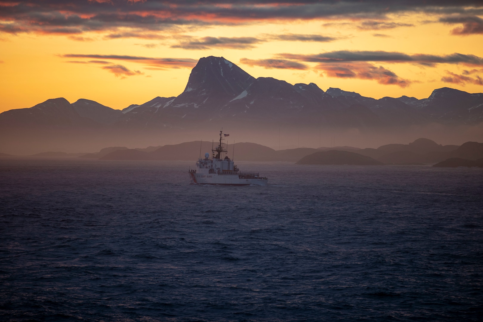 The U.S. Coast Guard Cutter Northland (WMEC 904) transits Godthab's Fjord alongside the Arleigh Burke-class guided-missile destroyer USS Delbert D. Black (DDG 119) during Operation NANOOK (OP NANOOK), Aug. 21, 2024. OP NANOOK is the Canadian Armed Forces' annual series of Arctic exercises designed to enhance defense capabilities, ensure the security of northern regions, and improve interoperability with Allied forces. Black participated in the operation alongside the U.S. Coast Guard and Canadian and Danish Allies to bolster Arctic readiness and fulfill each nation's defense commitments. (U.S. Navy Photo by Mass Communication Specialist 3rd Class Rylin Paul)