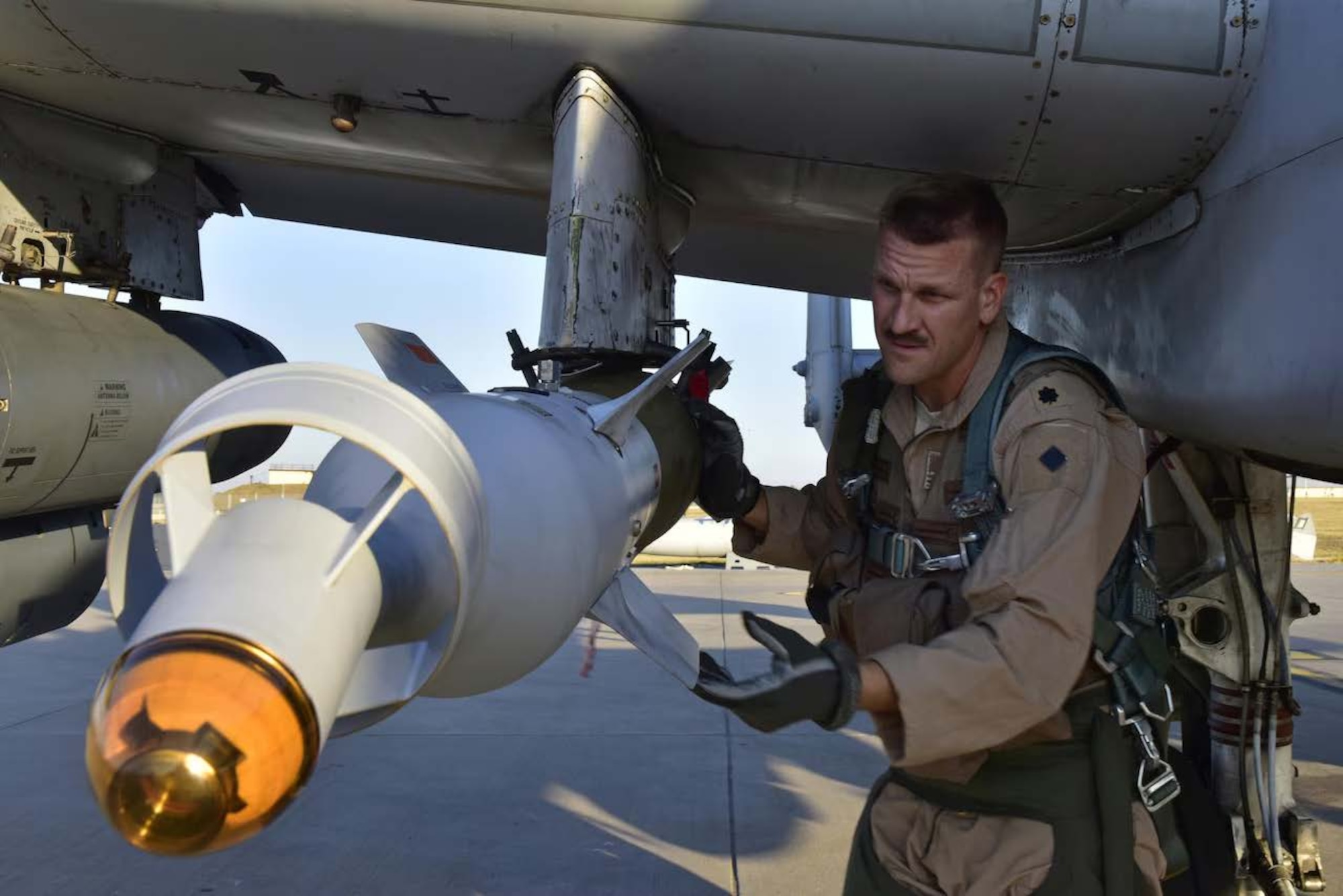 U.S. Air Force Lt. Col. Ben Rudolphi, 407th Expeditionary Operation Support Squadron commander, conducts a pre-flight munitions check on his A-10 Thunderbolt II at Incirlik Air Base, Turkey, July 11, 2017. Rudolphi has played a dual role in Operation Inherent Resolve, serving as a squadron commander and flying A-10s in the fight against the Islamic State of Iraq and Syria. (U.S. Air Force photo by Senior Airman Ramon A. Adelan)