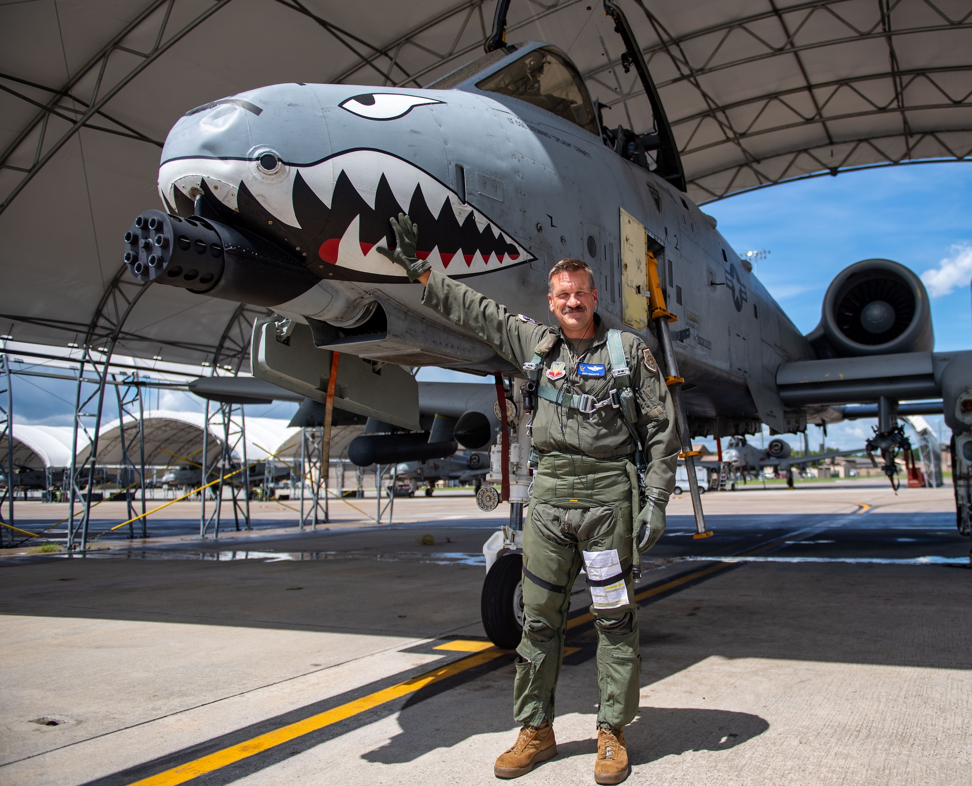 U.S. Air Force Col. Benjamin Rudolphi, 23rd Wing deputy commander, poses with his A-10C Thunderbolt II at Moody Air Force Base, Georgia, July 18, 2024. With 4,000+ Flight hours, Ruldolphi shares his extensive experience in the A-10C Thunderbolt II to as many people as possible to ensure the training and readiness of our forces, embodying the excellence and dedication required for mission success. (U.S. Air Force photo by 2nd Lt. Benjamin Williams)