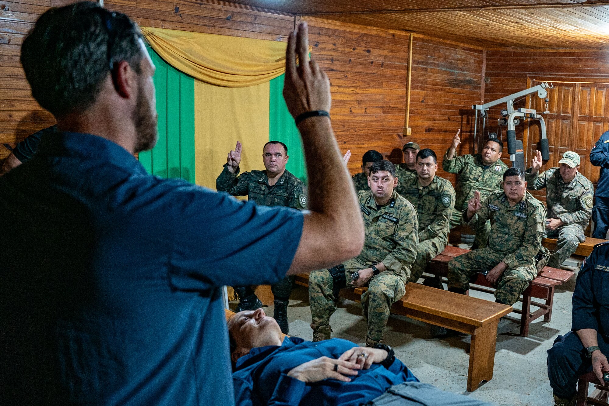 U.S. Army Sgt. 1st Class Robert Brattin, operating room non-commissioned officer assigned to the 759th Forward Resuscitative Surgical Detachment (Airborne), begins a Tactical Combat Casualty Care briefing with the Paraguayan National Police Department of Boquerón in Filadelfia, Paraguay, Aug. 3, 2024. The Paraguayan National Police of Boquerón welcomed the AMISTAD 24 participants to a collaborative exchange, showcasing their best practices and fostering enhanced cooperation and understanding. (U.S. Air Force photo by Tech. Sgt. Carly Feliciano)
