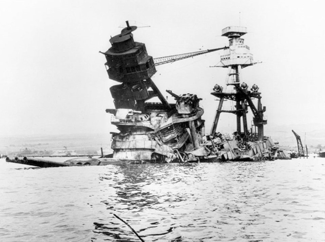 A battleship is broken and sunk in the sea.