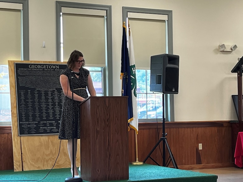 Sydney Curnes, a U.S. Army Corps of Engineers Landscape Architect and Nashville District Silver Jackets coordinator, delivers remarks at a ceremony on Aug. 23, 2024, honoring the Georgetown neighborhood and Rosenwald School District in Harlan, KY – a community that was devastated by a catastrophic flood in 1977. USACE Nashville District funded a high-water plaque that recounts the story of the flood and offers a personal perspective on the Georgetown community’s history, preserving the memory of this area that was deeply impacted by the disaster.