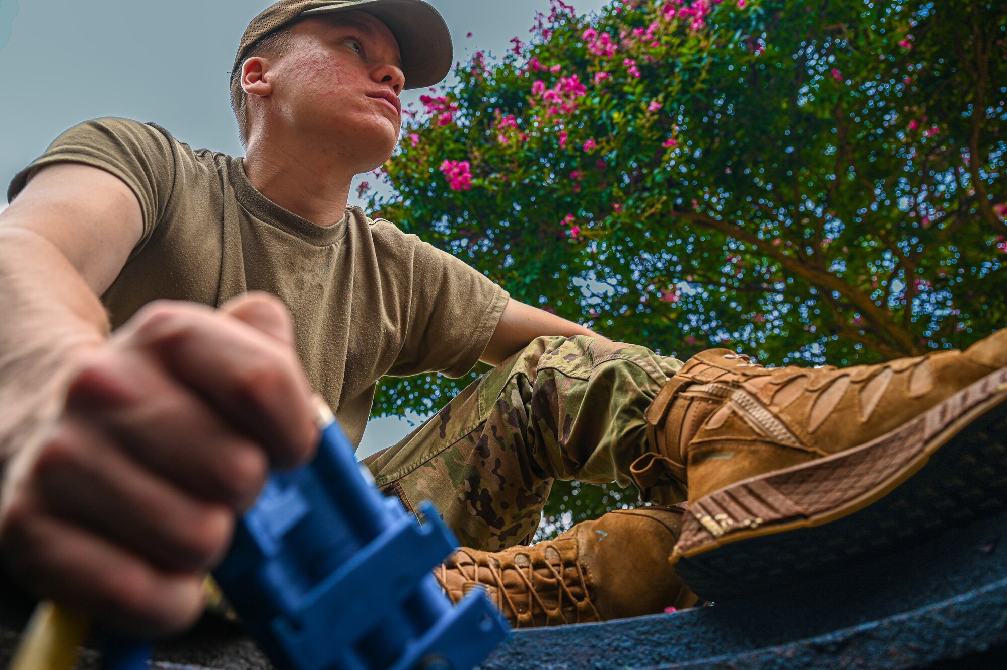 U.S. Air Force Airman 1st Class Colton Ash, 633d Civil Engineer Squadron water and fuel systems maintenance apprentice, holds the controller of a vacuum system at Joint Base Langley-Eustis, Virginia, Aug. 9, 2024. The controller manages and regulates the operation of the system, ensuring that the vacuum pressure is maintained at the correct levels. (U.S. Air Force photo by Airman 1st Class Skylar Ellis)