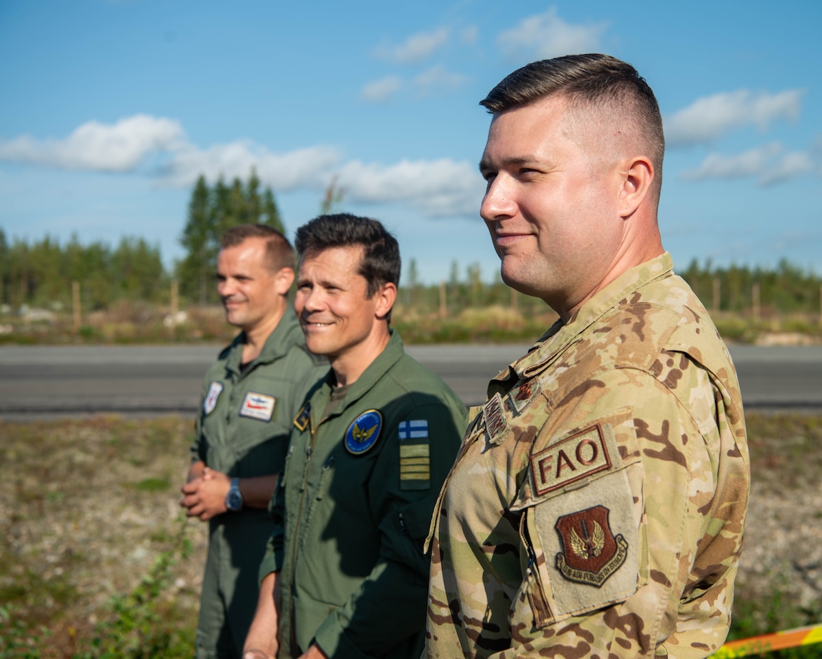 U.S. Lt. Col. David Deal, right, 435th Contingency Response Support Squadron commander, assigned to Ramstein Air Base, Germany stands with Finnish air force Col. Saku Joukas, middle, Lapland Air Wing commander, Finland and German air force Lt. Col. Thomas Kotting, left, Tactical Air Wing 71R commander assigned to Wittmund Air Base at a press conference during exercise BAANA 2024 on Hosio Highway strip, Ranua, Finland, Sept. 4. During the exercise U.S. Air Force Airmen expanded on Agile Combat Employment capabilities by learning austere environment aircraft landing and take-off operations and techniques from their Finnish counterparts. (U.S. Air Force photo by Airman 1st Class Tabatha Chapman)