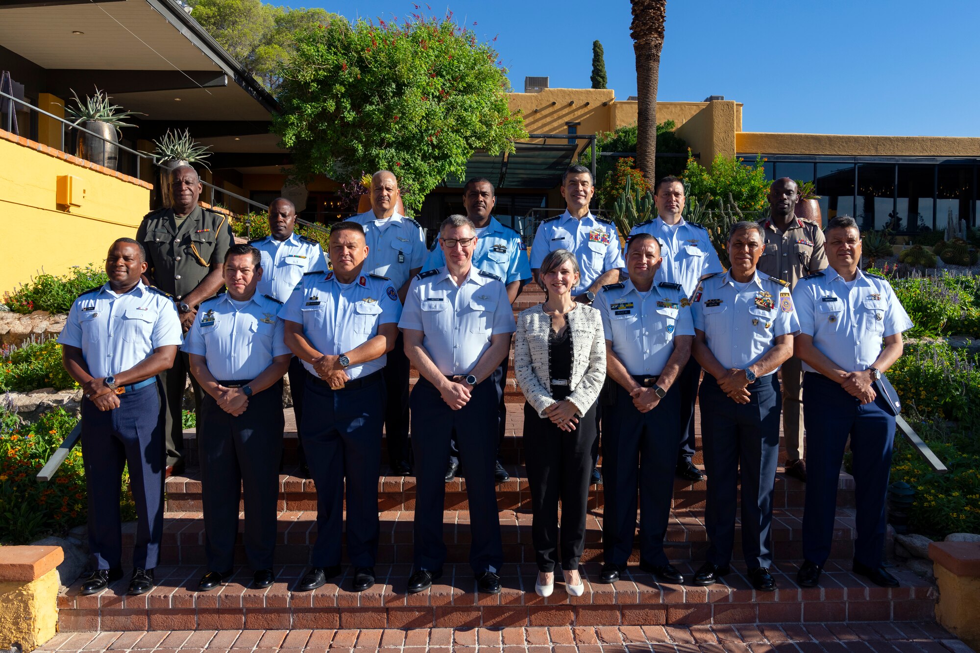 U.S. Air Force Maj. Gen. Evan Pettus, 12th Air Force (Air Forces Southern) commander, center left, and Ms. Ana Janaina Nelson, Deputy Assistant Secretary of Defense for the Western Hemisphere, center right, pose for a group photo with 13 partner nation delegates during the Central American and Caribbean Air Chiefs conference in Tucson, Arizona, Aug. 26, 2024. The CENTAM-CARIB 2024 conference was attended by partner nations from, Antigua and Barbuda, Belize, Colombia, Guatemala, Costa Rica, Dominican Republic, Honduras, Jamaica, Suriname, Guyana, Mexico, Panama and El Salvador. (U.S. Air Force photo by Tech. Sgt. Rachel Maxwell)