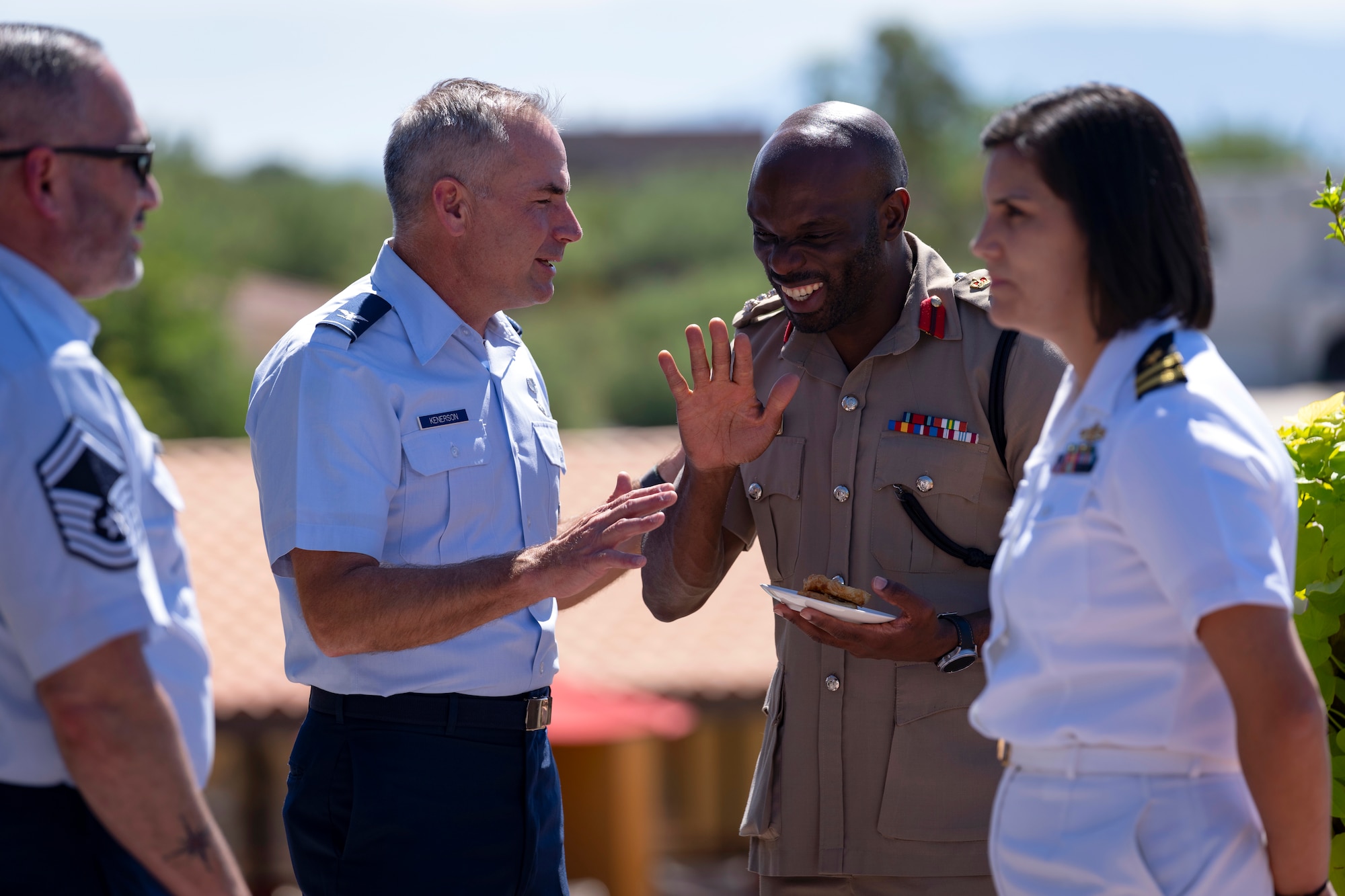 U.S. Air Force Col. Barton Kenerson, 12th Air Force (Air Forces Southern) logistics, engineering and force protection director, speaks with Jamaican Defence Force Air Wing Brigadier Elon Clarke, Brigade commander, Air and Cyber Command during the Central American and Caribbean Air Chiefs conference in Tucson, Arizona, Aug. 26, 2024. The week-long conference united key Air Force leaders from 13 Central American and Caribbean partner nations to work collaboratively to address future challenges and share best practices. (U.S. Air Force photo by Tech. Sgt. Rachel Maxwell)