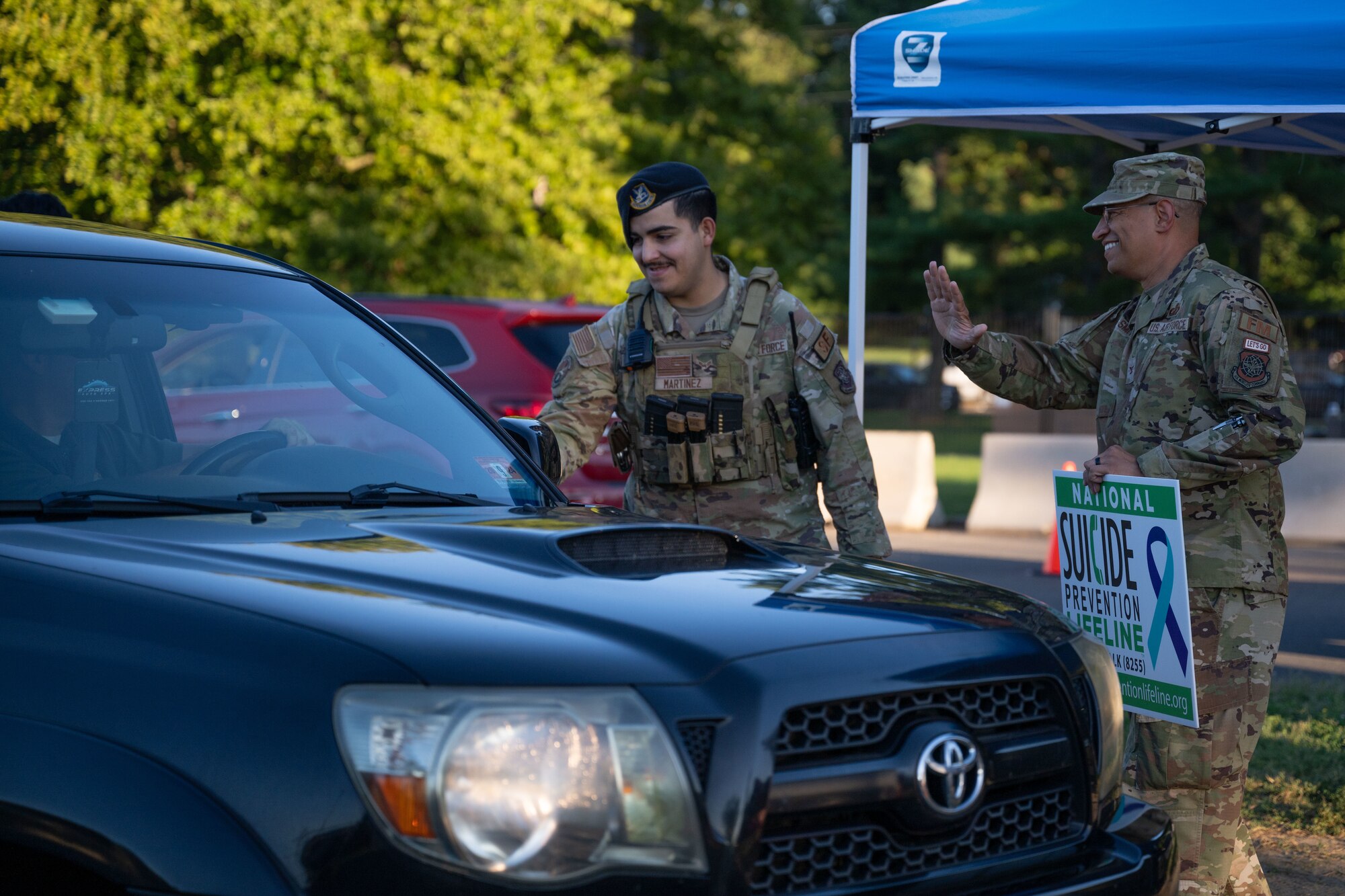 U.S. Air Force Col. Anthony Smith, Joint Base McGuire-Dix-Lakehurst commander and 87th Air Base Wing commander, greets people during a National Suicide Prevention Awareness Month event at JB MDL, N.J., Sept. 3, 2024. The month of September is the National Suicide Prevention Awareness Month where many organizations make a concerted effort to destigmatize the mental health struggles that many may face and take the opportunity to educate the public on recognizing signs someone is need of support as well as the avenues to receive support. (U.S. Air Force photo by Staff Sgt. Monica Roybal)