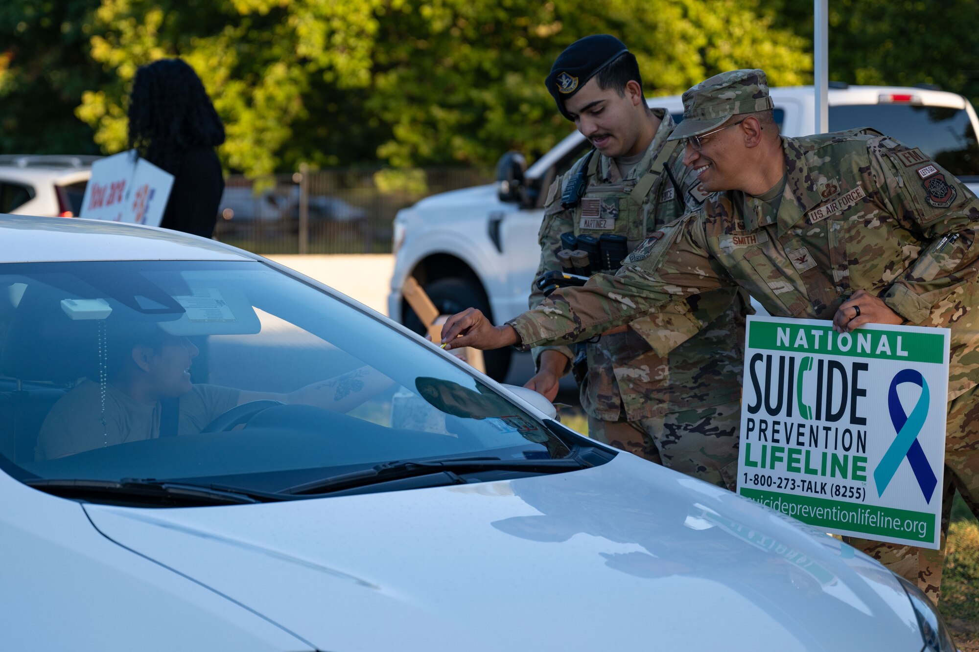 U.S. Air Force Col. Anthony Smith, Joint Base McGuire-Dix-Lakehurst commander and 87th Air Base Wing commander, passes out pins during a National Suicide Prevention Awareness Month event at JB MDL, N.J., Sept. 3, 2024. The month of September is the National Suicide Prevention Awareness Month where many organizations make a concerted effort to destigmatize the mental health struggles that many may face and take the opportunity to educate the public on recognizing signs someone is need of support as well as the avenues to receive support. (U.S. Air Force photo by Staff Sgt. Monica Roybal)