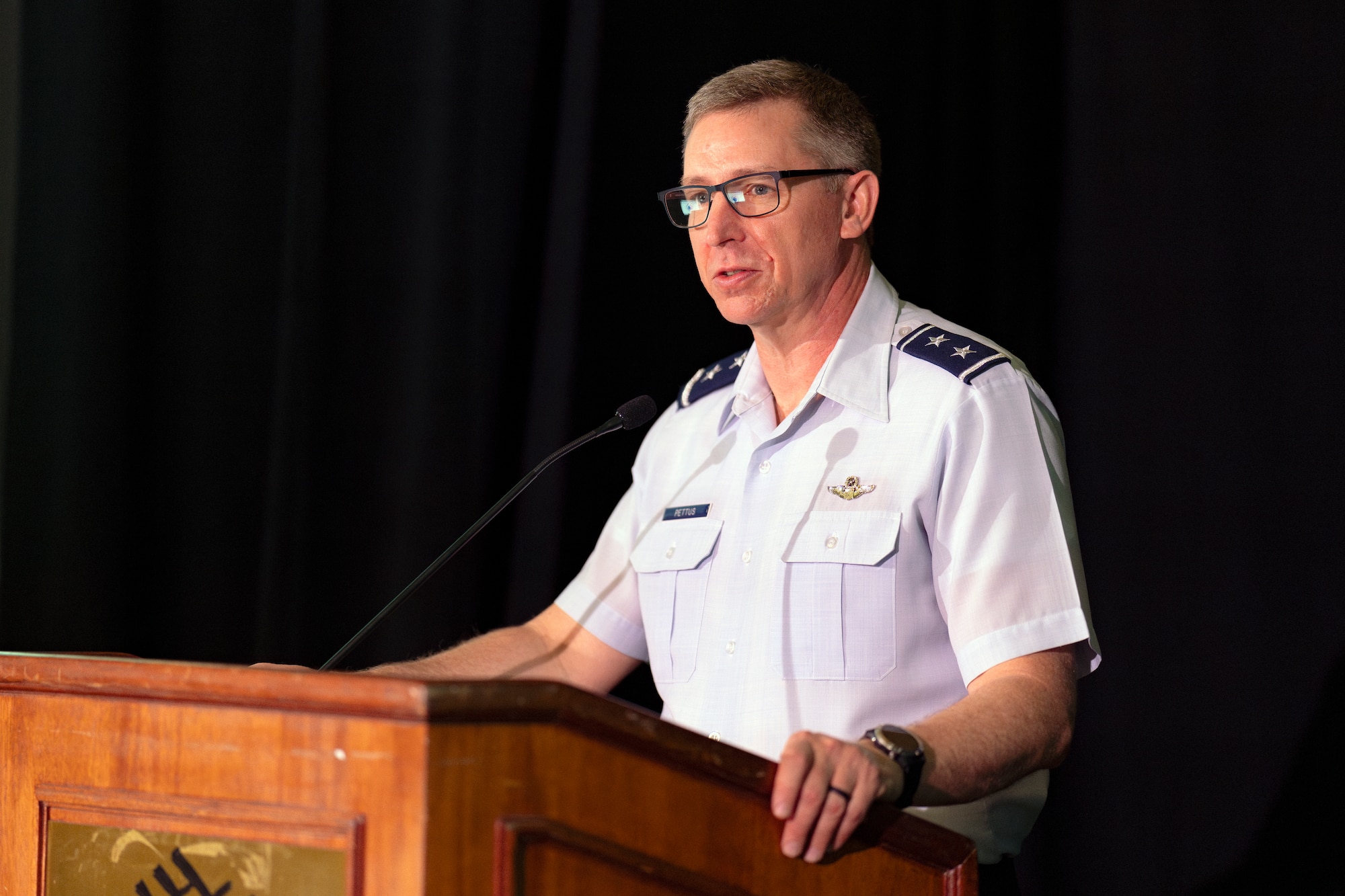U.S. Air Force Maj. Gen. Evan Pettus, 12th Air Force (Air Forces Southern) commander, provides opening remarks during the Central American and Caribbean Air Chiefs conference in Tucson, Arizona, Aug. 26, 2024. The week-long conference united key Air Force leaders from 13 Central American and Caribbean partner nations to work collaboratively to address future challenges and share best practices. (U.S. Air Force photo by Tech. Sgt. Rachel Maxwell)