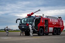 Firefighters assigned to the Japan Air Self-Defense Force 3rd Air Wing fire rescue enter the scene during an Emergency Management exercise.