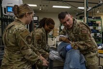 U.S. Air Force Airmen assigned to the 35th Medical Group simulate medical treatment for a casualty actor during an Emergency Management exercise.