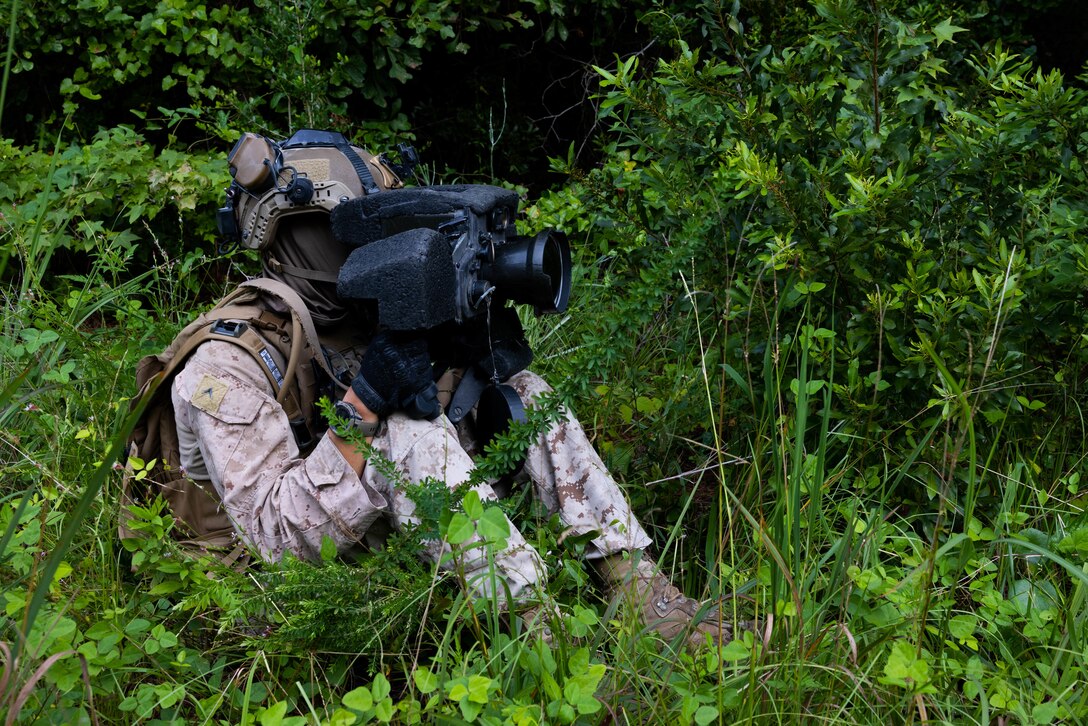 U.S. Marine Corps Pfc. Alden Bell, an anti-tank missile gunner with 3rd Battalion, 6th Marine Regiment, 2d Marine Division, looks through a command launch unit during a Battalion Field Exercise at Marine Corps Base Camp Lejeune, North Carolina, Aug. 23, 2024. The Battalion FEX allowed the Marines to increase proficiency in military operations in urban environments and enhance unit cohesion. (U.S. Marine Corps photo by Lance Cpl. Christian Alston)