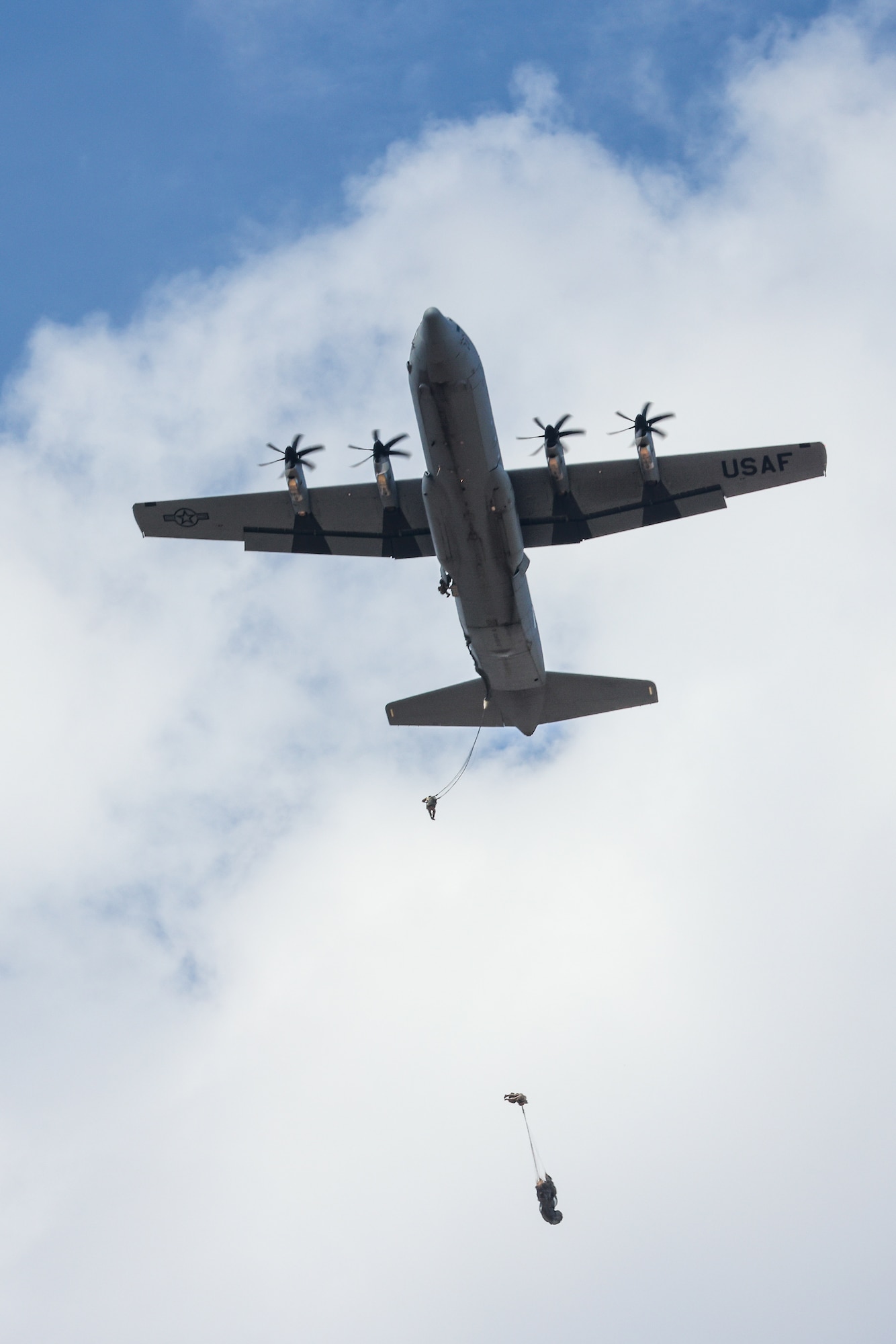 435th Contingency Response Group paratroopers fall to the ground after performing a static-line jump from a C-130J Super Hercules, assigned to the 37th Airlift Squadron, during Thracian Summer 2024, August 20, 2024, in Plovdiv, Bulgaria.