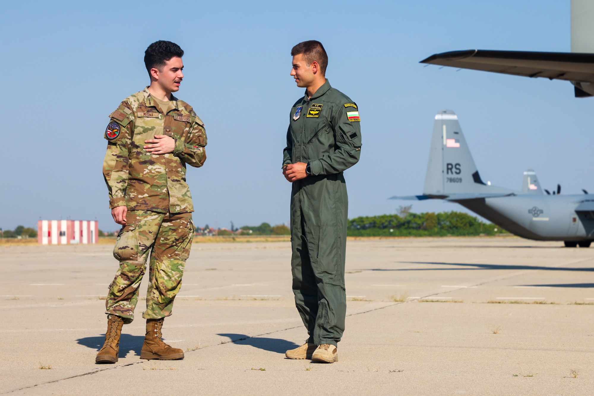 U.S. Air Force Senior Airman Casey Medina, 86th Maintenance Squadron heavy aircraft integrated avionics journeyman, connects with a member of the Bulgarian air force during a media event for Thracian Summer 2024, August 24, 2024, in Plovdiv, Bulgaria.