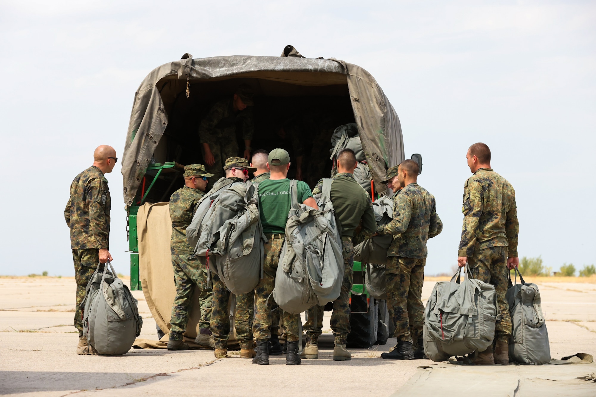 Bulgarian paratroopers load their equipment, following a series of static-line jumps, alongside U.S. counterparts during Thracian Summer 2024, August 20, 2024, in Plovdiv, Bulgaria.