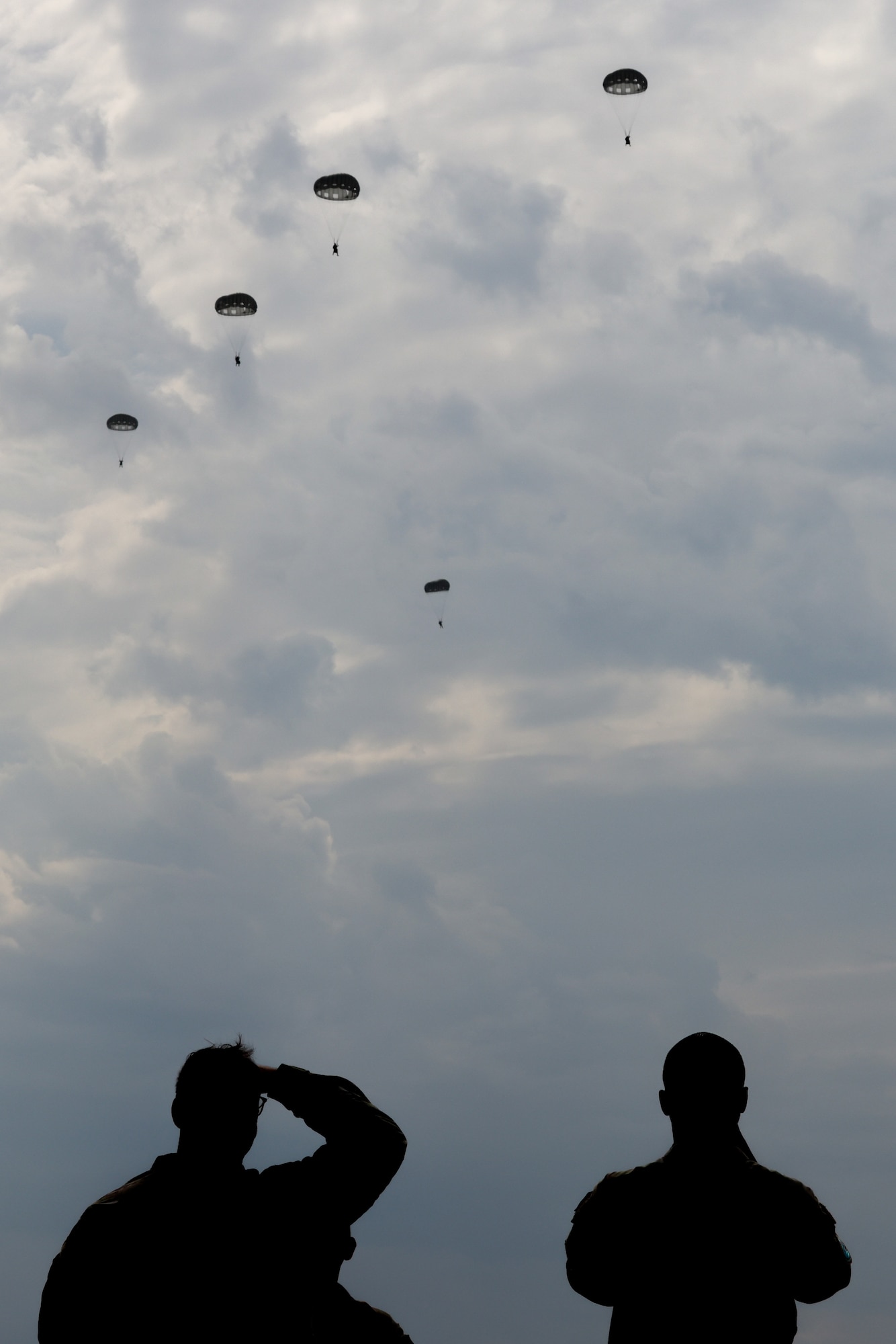 435th Contingency Response Group paratroopers fall to the ground after performing a static-line jump from a C-130J Super Hercules, assigned to the 37th Airlift Squadron, during Thracian Summer 2024, August 20, 2024, in Plovdiv, Bulgaria.