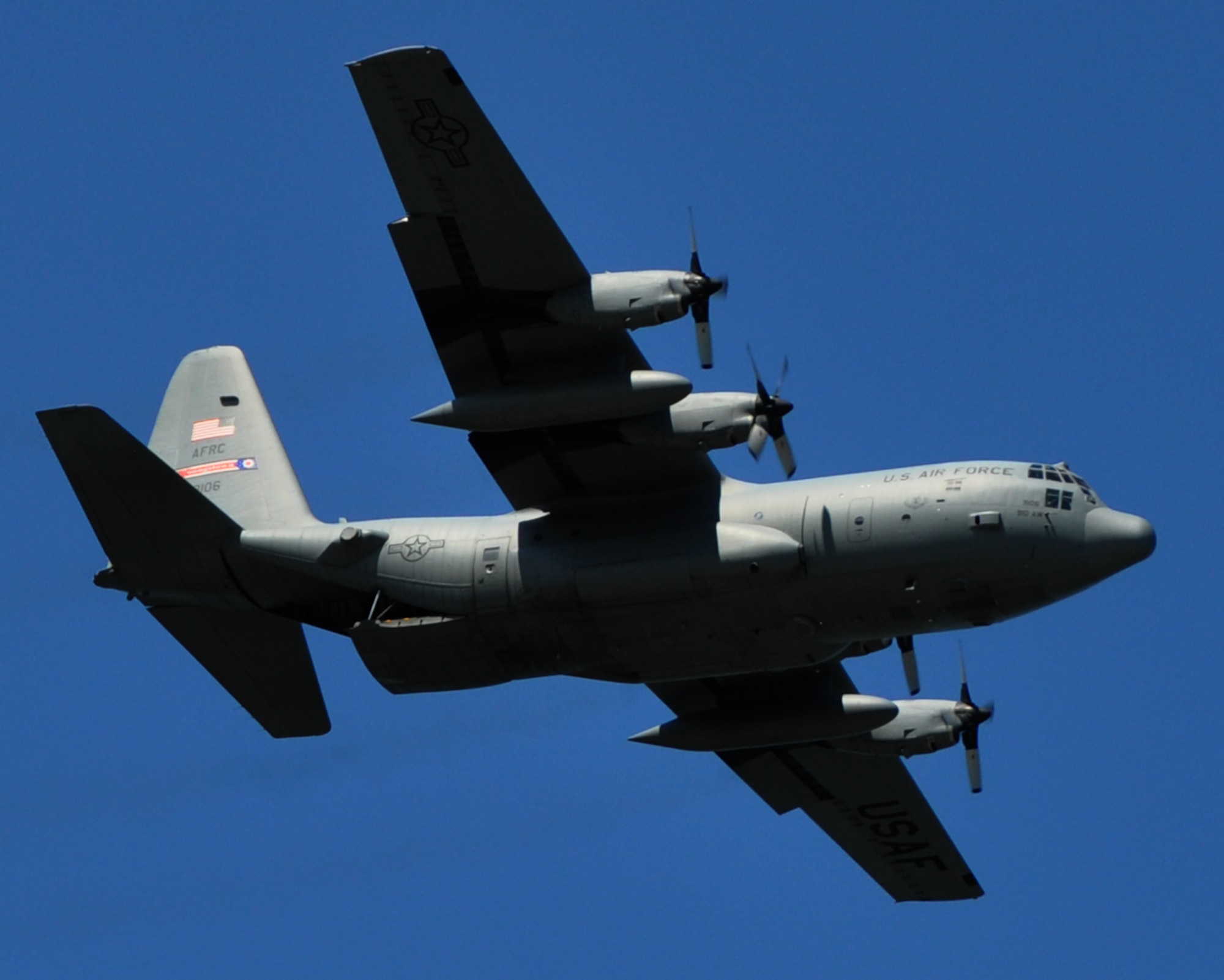 A C-130H Hercules aircraft assigned to the 910th Airlift Wing, based at nearby Youngstown Air Reserve Station, Ohio, performs a low and slow pass as part of a demonstration flight during the 2024 Cleveland National Air Show at Burke Lakefront Airport, Sept. 1, 2024.