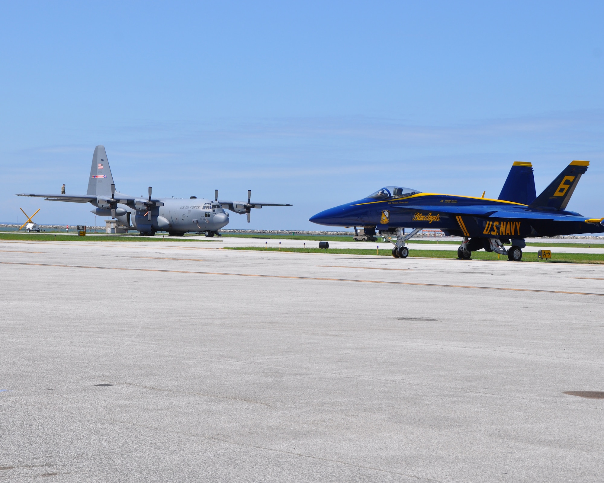 A C-130H Hercules aircraft assigned to the 910th Airlift Wing, based at nearby Youngstown Air Reserve Station, Ohio, sits on the ramp following a demonstration flight during the 2024 Cleveland National Air Show, held at Burke Lakefront Airport, Sept. 1, 2024.