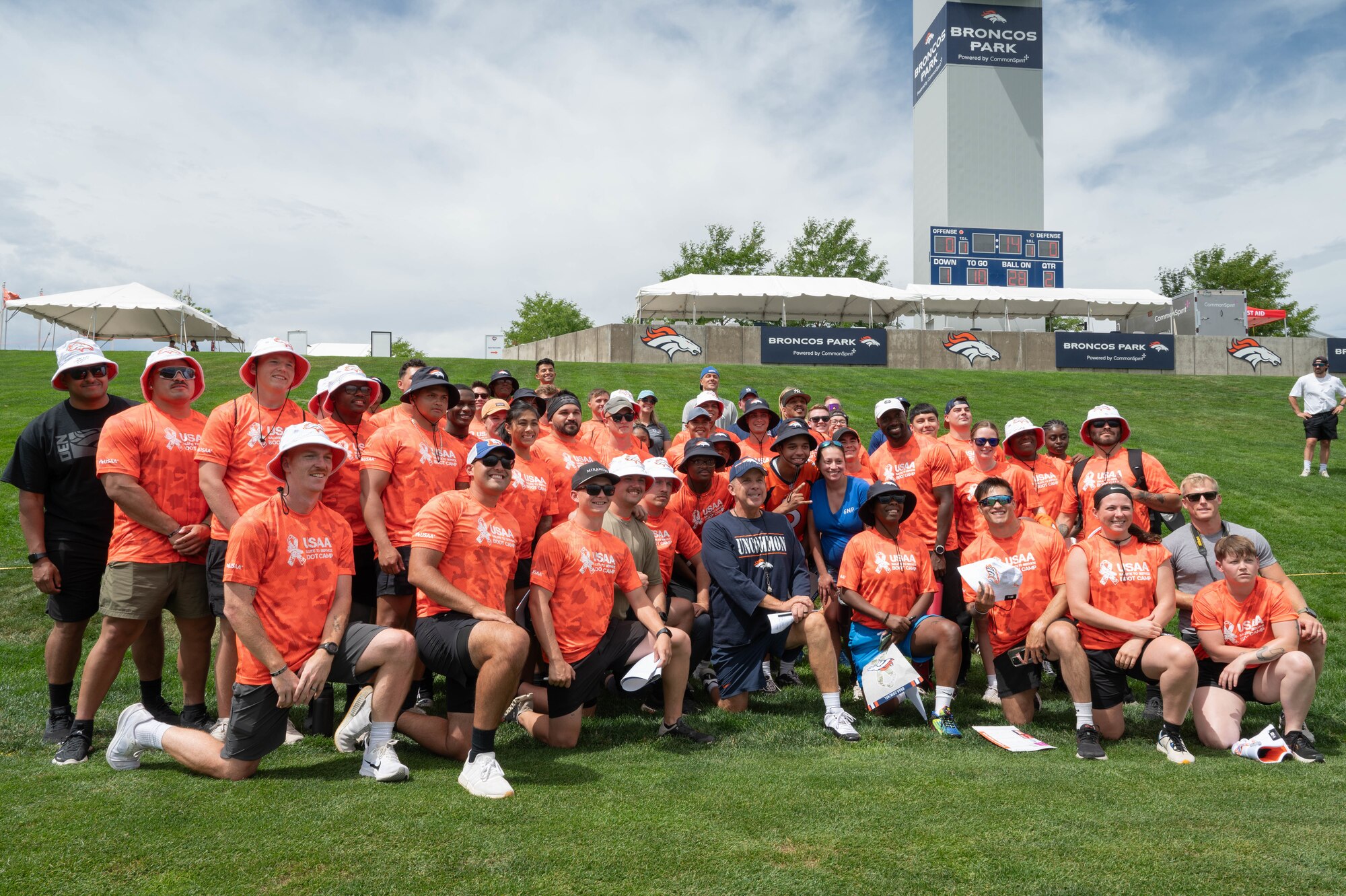 During the Denver Broncos' training camp Sean Payton, Denver Broncos head coach, posed with U.S. service members.