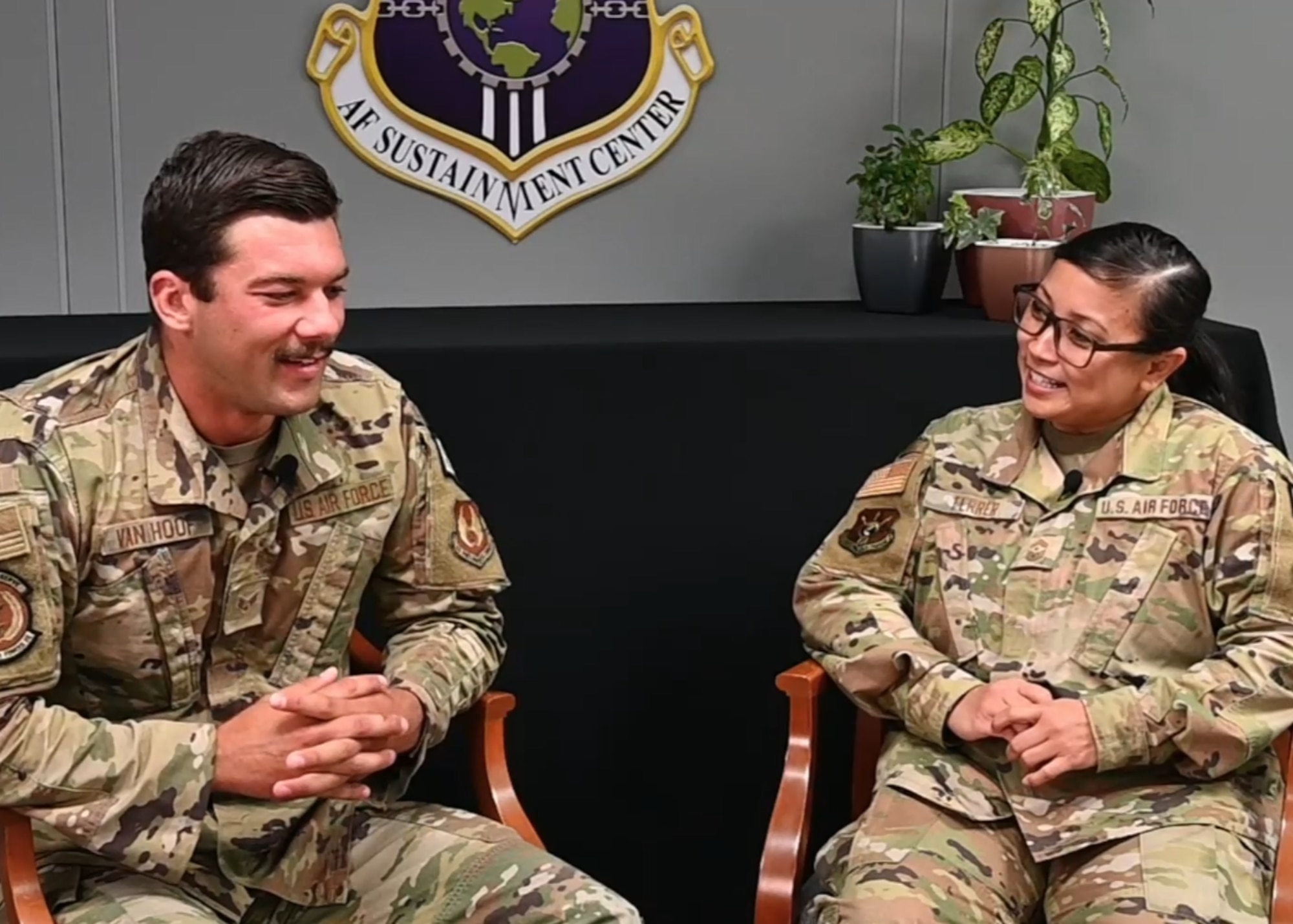 Chief Master Sergeant Beth Ferrer, command chief Air Force Sustainment Center, interviews Senior Airman Codey Van Hoof, installation defense patrolman, 72d Security Forces Squadron.