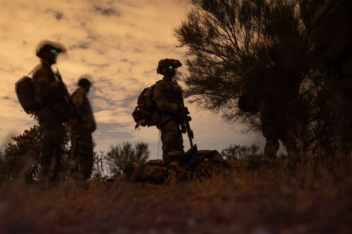 U.S. Air Force pararescuemen assigned to the 68th Rescue Squadron strategize during the Combat Leader Course at Davis-Monthan Air Force Base, Arizona, Aug. 26, 2024. Pararesuemen found and rescued simulated patients while also engaging with opposing forces during different scenarios. (U.S. Air Force photo by Airman 1st Class Jasmyne Bridgers-Matos)