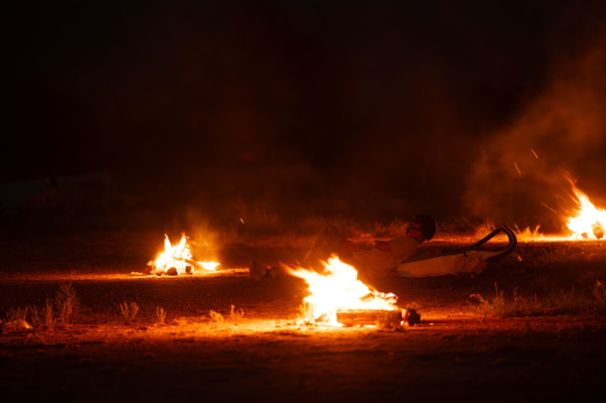 A simulated patient awaits rescue at the site of a crash during the Combat Leader Course at Davis-Monthan Air Force Base, Arizona, Aug. 27, 2024. The scenario involved a simulated aircraft crash and patients for pararescuemen to locate. (U.S. Air Force photo by Airman First Class Jasmyne Bridgers-Matos)
