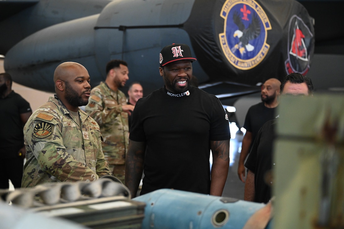 MSgt Dion Smith, loading standardization crew chief from the 2nd Maintenance Group, briefs Curtis "50 Cent" Jackson on the weapons employed by the B-52H Stratofortress during a tour at Barksdale Air Force Base, La., July 18, 2024.