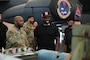 MSgt Dion Smith, loading standardization crew chief from the 2nd Maintenance Group, briefs Curtis "50 Cent" Jackson on the weapons employed by the B-52H Stratofortress during a tour at Barksdale Air Force Base, La., July 18, 2024.