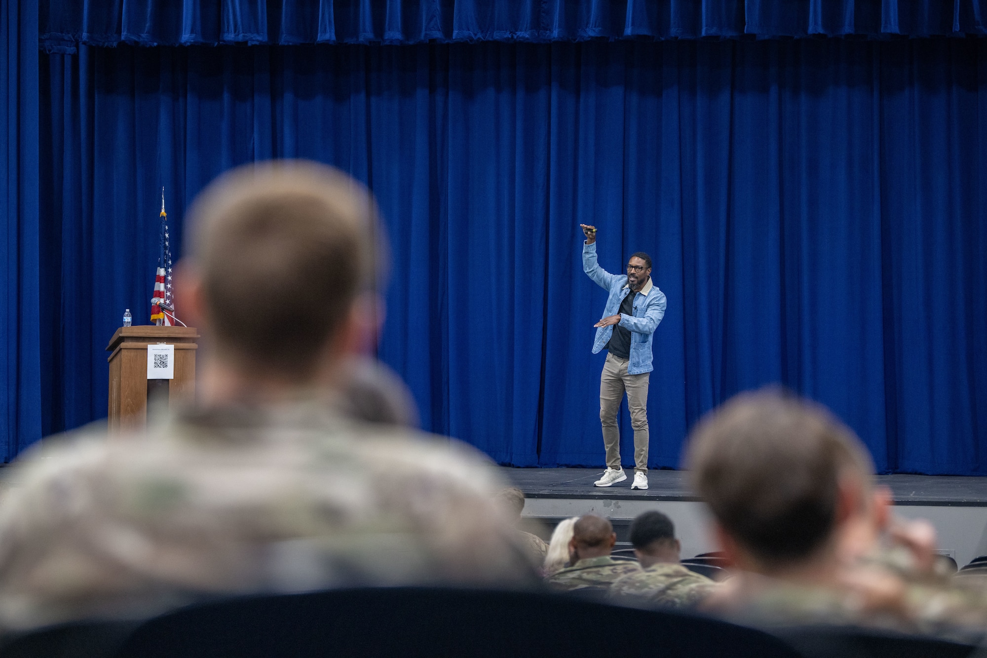 Mental health motivational speaker and former NFL player, Tra Battle, delivers a mental health speech at Moody Air Force Base, Georgia, Aug. 29, 2024. Battle discussed his story when he was at his lowest point to combat the stigma of seeking mental health assistance. (U.S. Air Force photo by 2nd Lt. Benjamin Williams).