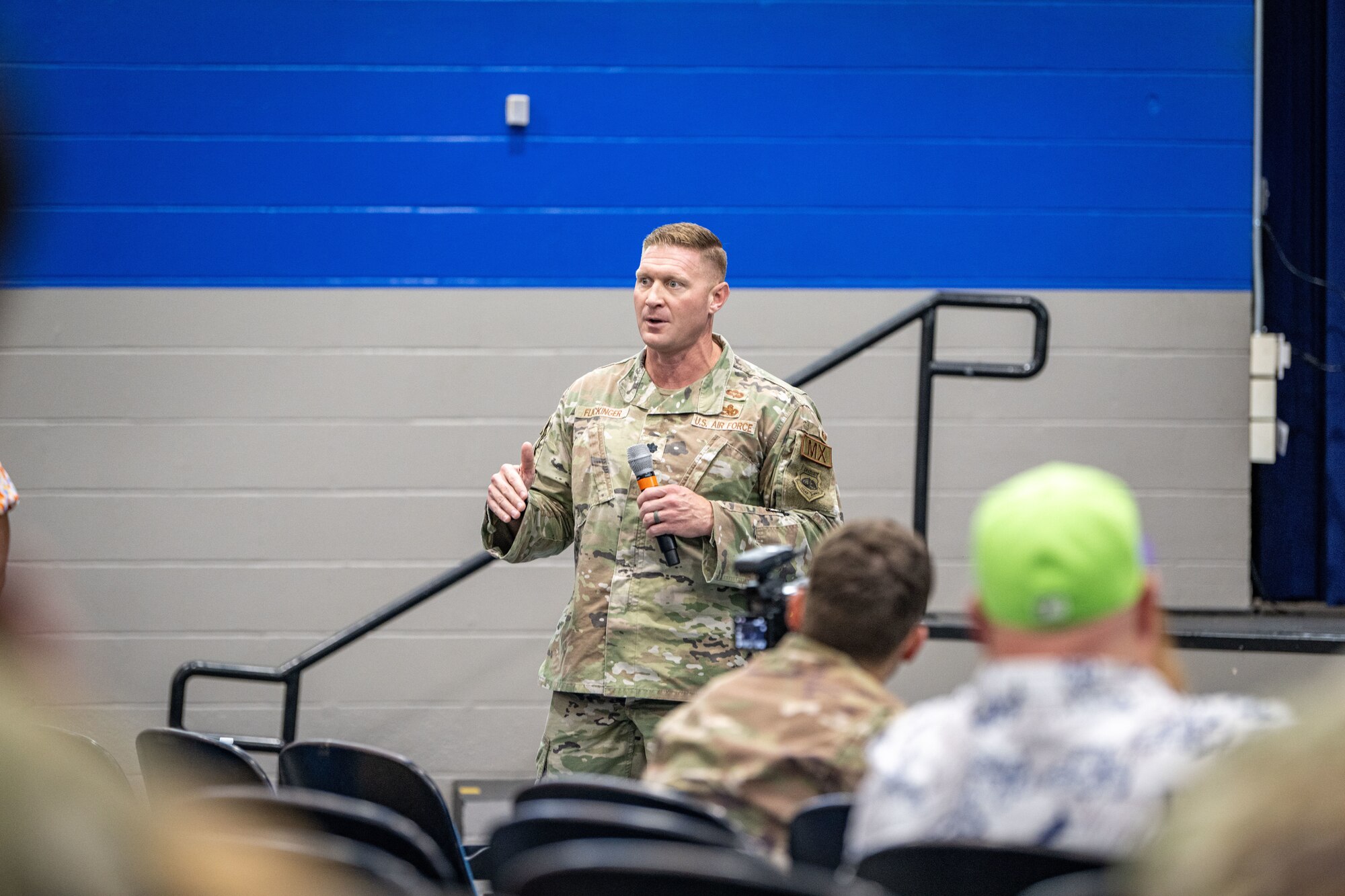 U.S. Air Force Lt Col. Brett Flickinger, 23rd Maintenance Group deputy commander, speaks about his leadership philosophy regarding mental health readiness at Moody Air Force Base, Georgia, Aug. 29, 2024. Tra Battle, former NFL and University of Georgia football player, visited the Airmen to provide a powerful message on mental health, emphasizing the importance of seeking help. (U.S. Air Force photo by 2nd Lt. Benjamin Williams).
