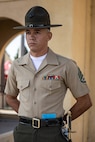 U.S. Marine Corps Staff Sgt. Aaron Ruiz, a senior drill instructor with Lima Company, 3rd Recruit Training Battalion, waits to begin his final drill evaluation at Marine Corps Recruit Depot San Diego, California, Aug. 24, 2024. During the final drill evaluation, the platoons are scored based on their uniforms, bearing, and movements, as well as the senior drill instructor’s cadence, sword control, and movement commands. (U.S. Marine Corps photo by Sgt. Jesse K. Carter-Powell)