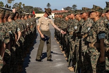 U.S. Marine Corps Staff Sgt. Jacob Landis, the drill master for 3rd Recruit Training Battalion, Recruit Training Regiment, inspects a platoon with Lima Company, 3rd Recruit Training Battalion during their final drill evaluation at Marine Corps Recruit Depot San Diego, California, Aug. 24, 2024. During the final drill evaluation, the platoons are scored based on their uniforms, bearing, and movements, as well as the senior drill instructor’s cadence, sword control, and movement commands. (U.S. Marine Corps photo by Sgt. Jesse K. Carter-Powell)