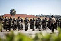 U.S. Marine Corps Staff Sgt. Aaron Ruiz, a senior drill instructor with Lima Company, 3rd Recruit Training Battalion, conducts a final drill evaluation at Marine Corps Recruit Depot San Diego, California, Aug. 24, 2024. During the final drill evaluation, the platoons are scored based on their uniforms, bearing, and movements, as well as the senior drill instructor’s cadence, sword control, and movement commands. (U.S. Marine Corps photo by Sgt. Jesse K. Carter-Powell)
