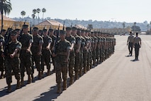 U.S. Marine Corps Staff Sgt. Aaron Ruiz, a senior drill instructor with Lima Company, 3rd Recruit Training Battalion, marches his platoon during a final drill evaluation at Marine Corps Recruit Depot San Diego, California, Aug. 24, 2024. During the final drill evaluation, the platoons are scored based on their uniforms, bearing, and movements, as well as the senior drill instructor’s cadence, sword control, and movement commands. (U.S. Marine Corps photo by Sgt. Jesse K. Carter-Powell)