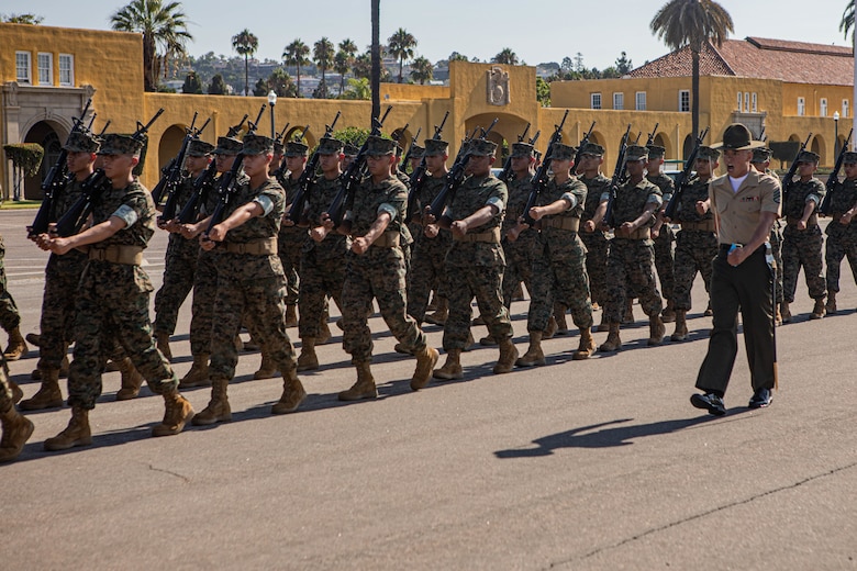 U.S. Marine Corps Staff Sgt. Aaron Ruiz, a senior drill instructor with Lima Company, 3rd Recruit Training Battalion, marches his platoon during a final drill evaluation at Marine Corps Recruit Depot San Diego, California, Aug. 24, 2024. During the final drill evaluation, the platoons are scored based on their uniforms, bearing, and movements, as well as the senior drill instructor’s cadence, sword control, and movement commands. (U.S. Marine Corps photo by Sgt. Jesse K. Carter-Powell)