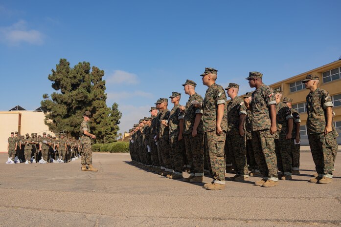 U.S. Marine Corps Staff Sgt. Cameron Partee, a drill instructor with Delta Company, 1st Recruit Training Battalion, speaks to recruits during a post exchange and haircut call at Marine Corps Recruit Depot San Diego, California, Aug. 19, 2024. Recruits are allowed to go to the PX to buy necessary supplies and receive haircuts weekly during their time at MCRD San Diego in order to maintain a uniform appearance and promote good hygiene throughout recruit training. (U.S. Marine Corps photo by Lance Cpl. Janell B. Alvarez)