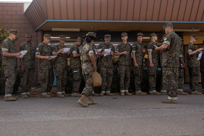 U.S. Marine Corps Sgt. Natasha Ajin, a drill instructor with Delta Company, 1st Recruit Training Battalion, reviews knowledge with the recruits during a post exchange and haircut call at Marine Corps Recruit Depot San Diego, California, Aug. 19, 2024. Recruits are allowed to go to the PX to buy necessary supplies and receive haircuts weekly during their time at MCRD San Diego in order to maintain a uniform appearance and promote good hygiene throughout recruit training. (U.S. Marine Corps photo by Lance Cpl. Janell B. Alvarez)