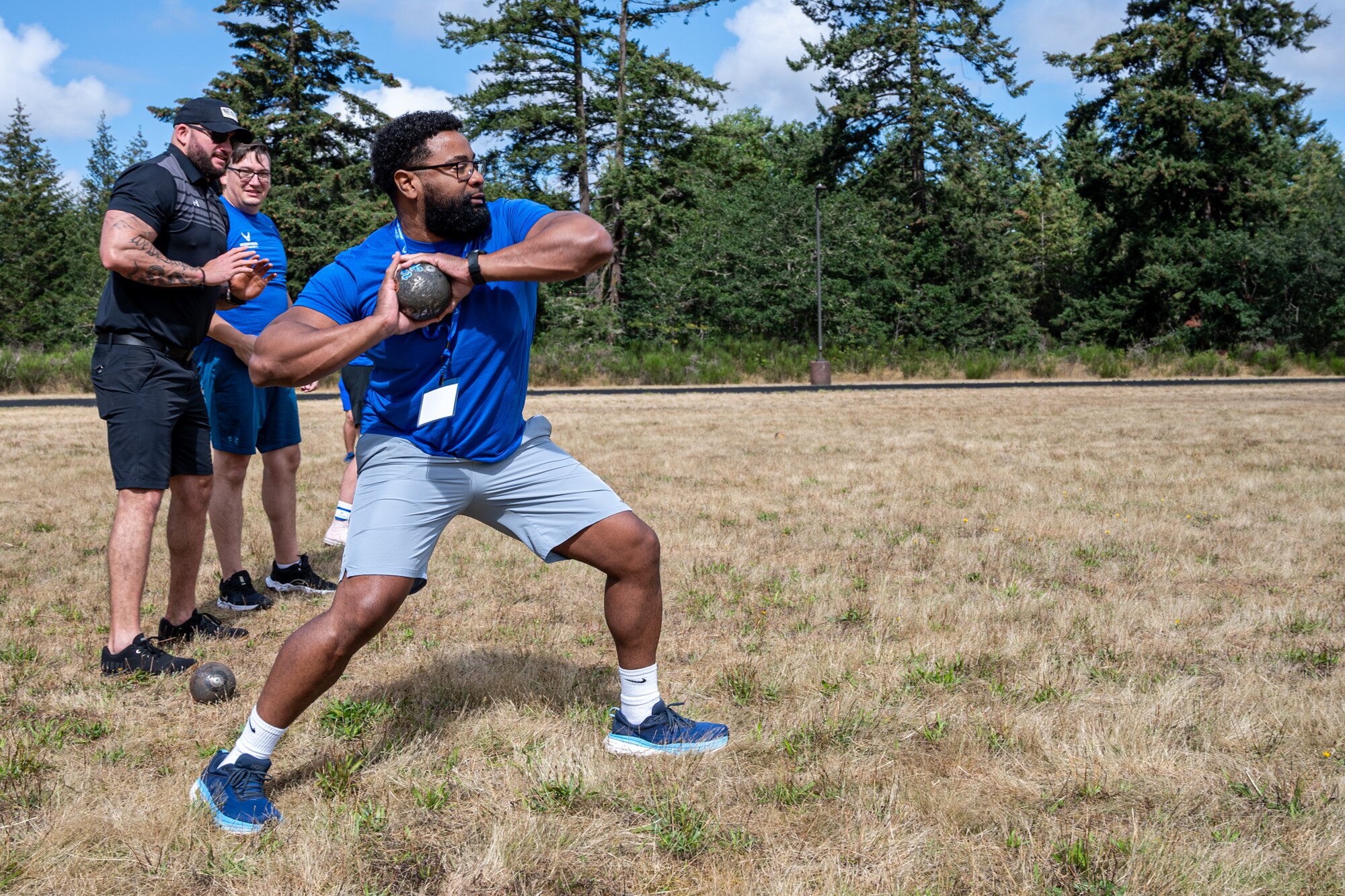 U.S. Air Force Tech Sgt. Brandon Davis, Joint Base Anacostia-Bolling, Washington, D.C., Honor Guard noncommissioned officer in charge, throws a shot put during an Air Force Wounded Warrior event at Joint Base Lewis-McChord, Washington, Aug. 27, 2024.