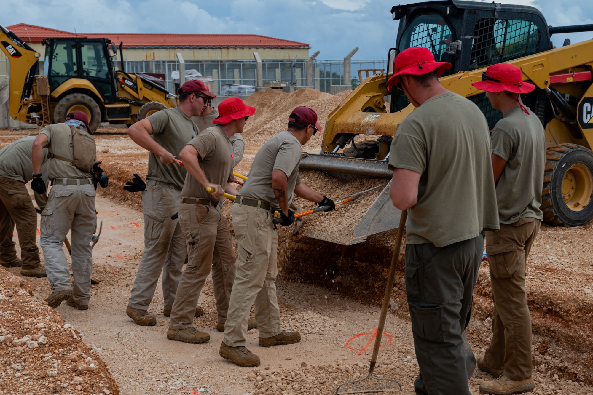 Airmen assigned to the 554th Rapid Engineer Deployable Heavy Operational Repair Squadron Engineers, prepare a foundation for a K-SPAN at Andersen Air Force Base, Guam, Aug. 29, 2024. A K-SPAN is a storage facility for deployable assets, which helps increase the lifetime of equipment. (U.S. Air Force photo by Senior Airman Jasmine M. Barnes)