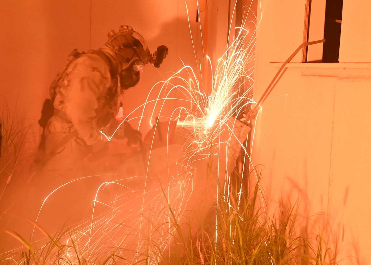 A man using a saw