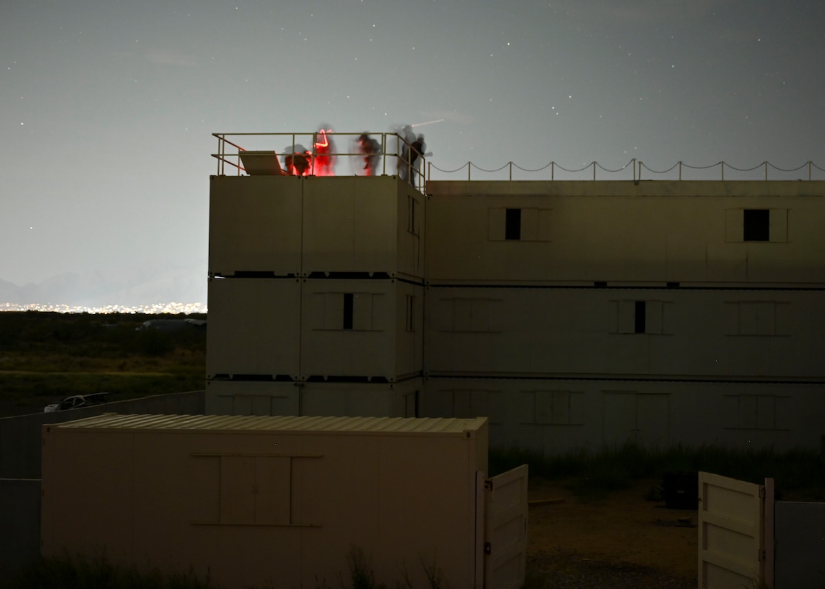 People on top of a building at night