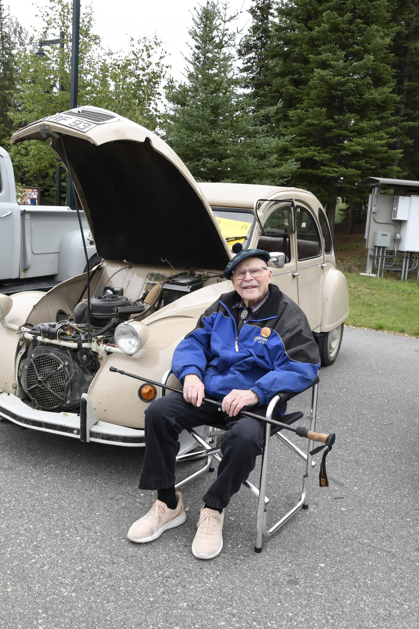 Ed McLaughlin, a World War II Veteran and a Vernon Nash Antique Auto Club member, poses for a photo during the Fairbanks Veterans Stand Down event at Pioneer Park Civic Center in Fairbanks, Alaska