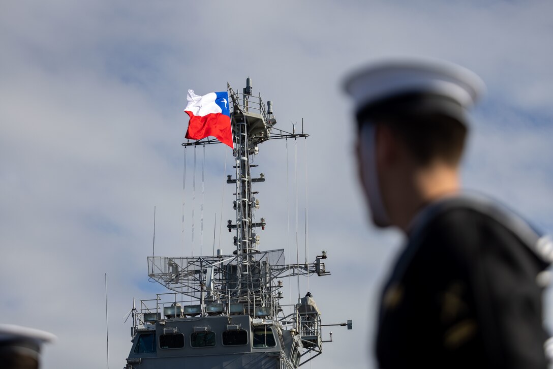 A Chilean sailor looks at the flag of Chile during the opening ceremony for Exercise UNITAS LXV aboard LSDH 91 “Sargento Aldea”, Chile, Sept. 2, 2024. The ceremony kicked off the 65th annual UNITAS where 25 nations will train together to strengthen partnerships and interoperability.