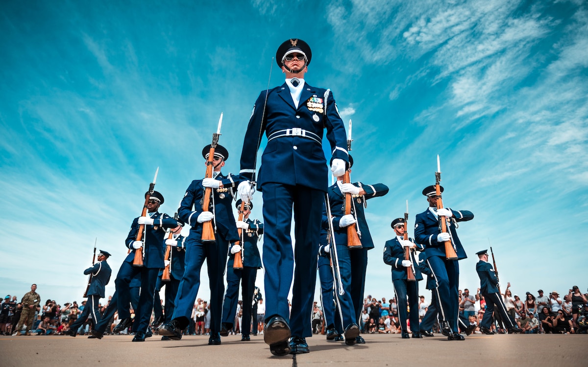 The U.S. Air Force Honor Guard perform for a crowd during the Luke Days 2024 Airshow, March 22, 2024, at Luke Air Force Base Arizona. Both the Thunderbirds and the USAF Honor Guard underscore the highest standards of precision, representing the USAF's commitment to excellence and air superiority. The mission of the U.S. Air Force Honor Guard is to represent Airmen to the American public and the world. (U.S Air Force Photo by Airman 1st Class Katelynn Jackson)