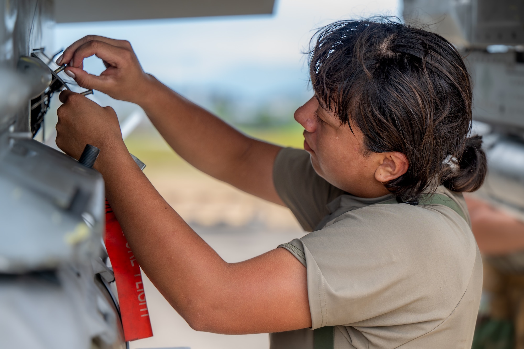 U.S. Air Force Airman Joselyne Jacobo, 8th Fighter Generation Squadron weapons load crew member, secures an inert GBU-31 armament during Ulchi Freedom Shield 24 at an unspecified location in the Republic of Korea, Republic of Korea, Aug. 20, 2024. Training is conducted throughout the year to generate combat airpower at a moment’s notice, affirming the commitment to the Republic of Korea remains ironclad and ensures regional stability throughout the U.S. Indo- Pacific Command. (U.S. Air Force photo by Senior Airman Brittany Russell)