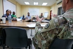 Louisiana Army National Guard Chaplain Col. David Yellott reviews training and evaluations with the Belize Defence Force Wellness Team and Coast Guard leadership during a State Partnership Program wellness exchange at Price Barracks in Ladyville, Belize, Aug. 20, 2024.