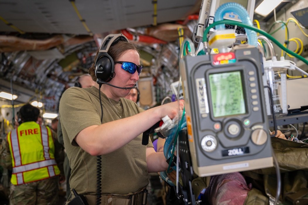 U.S. Air Force Staff Sgt. Lauren Rosenhoover, cardiopulmonary technician, 140th Wing, Colorado National Guard, trains alongside other critical care air transport team members in properly allocating resources in the event of an inflight patient emergency during a Medical Readiness University capstone exercise at Alpena Combat Readiness Training Center, Alpena, Michigan, June 13, 2024. This large-scale training event provided Total Force Airmen with hands-on and real-world operational training at a reduced cost for more than 21 medical career specialties. (U.S. Air National Guard photo by Tech. Sgt. Sarah M. McClanahan)