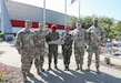 Kentucky National Guard leaders pose with the small contingent of logistics officers from the Djiboutian Armed Forces after presenting them with a give a plaque during their visit to the Corvette Museum in Bowling Green, Ky., Aug. 22, 2024. The visit was part of the National Guard's State Partnership Program, which started in 2015 between Kentucky and Djibouti. During the visit, they toured the CSSB's armory, field maintenance shop 10 and the famous Corvette Museum. (U.S. Army National Guard photos by Sgt. 1st Class Benjamin Crane)