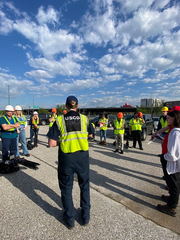 ASOFR MSTC Jennifer Gramata, conducting a safety brief with multiple media members and Army Corps personnel prior to arriving to the Sparrows Point staging area. She emphasized topics to include unauthorized work zones, heat stress hazards and high hazard areas and ensured accountability for the site.