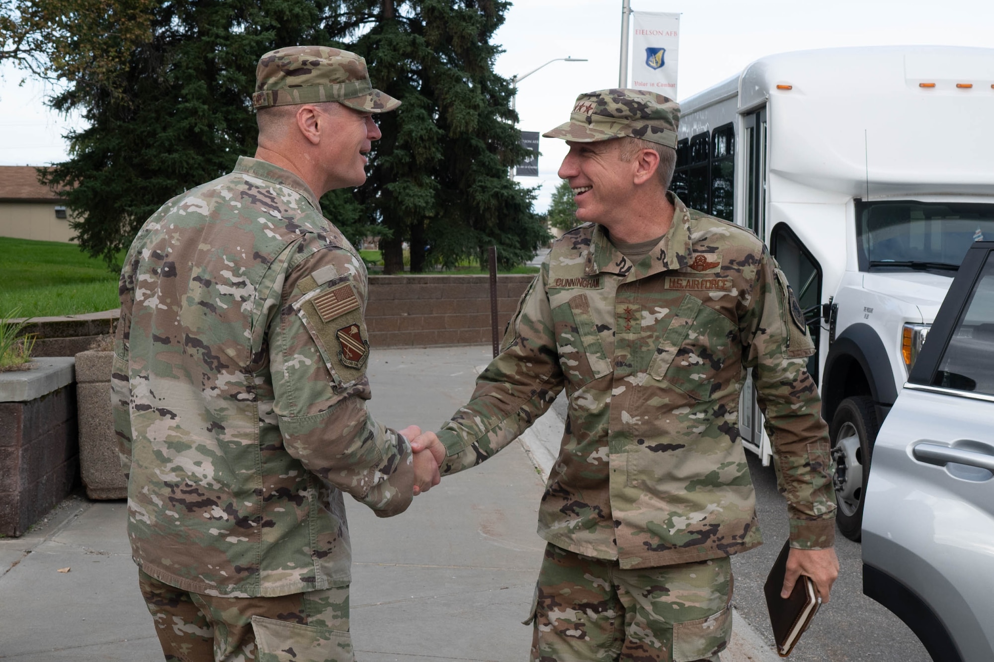 U.S. Air Force Col. Paul Townsend, 354th Fighter Wing commander, left, greets Lt. Gen. Case Cunningham, commander, Alaskan North American Aerospace Defense Region, Alaskan Command, and Eleventh Air Force, during his immersion tour at Eielson Air Force Base, Alaska, Aug. 28, 2024.